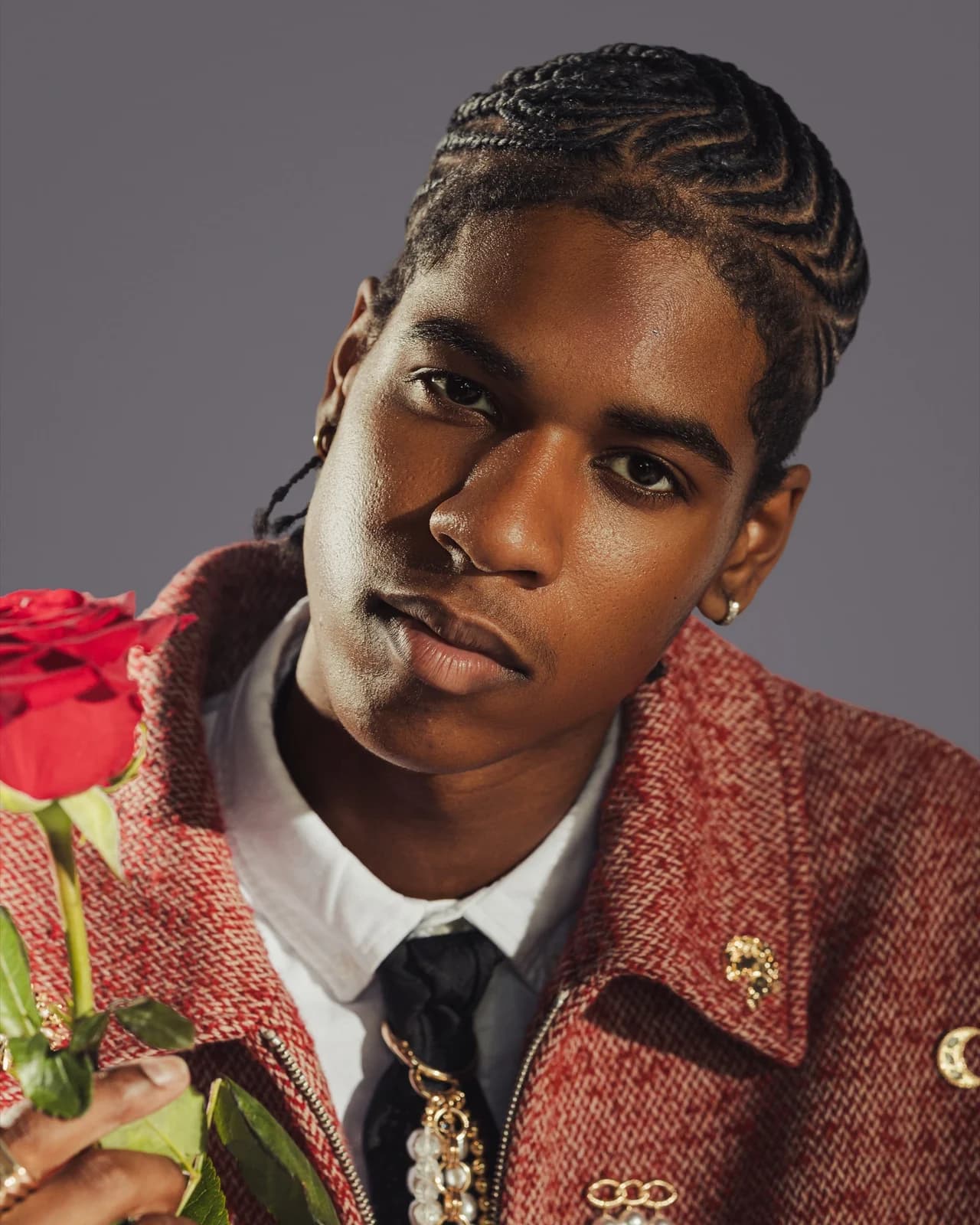 Portrait with a red rose, displayed as a suspended gallery print